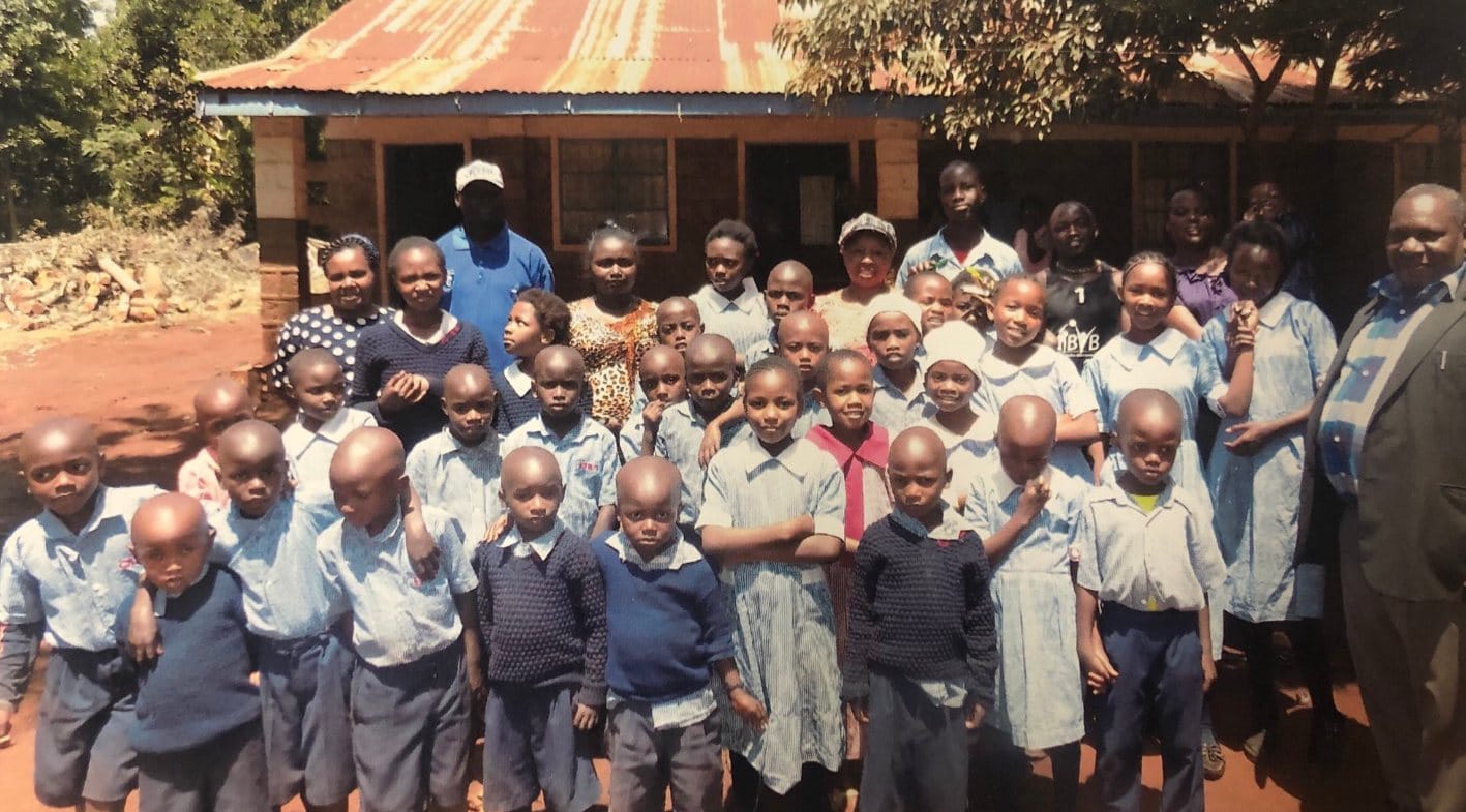 Children and staff of The Bridge of Hope Foundation gathered outside the home in Narok